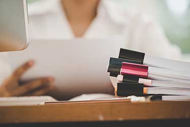 businesswoman-with-documents-in-foreground